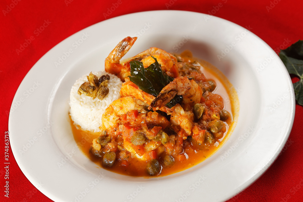 Shrimp with caper, chaya leaf and steamed rice. Shrimp with caper, chaya leaf and steamed rice.