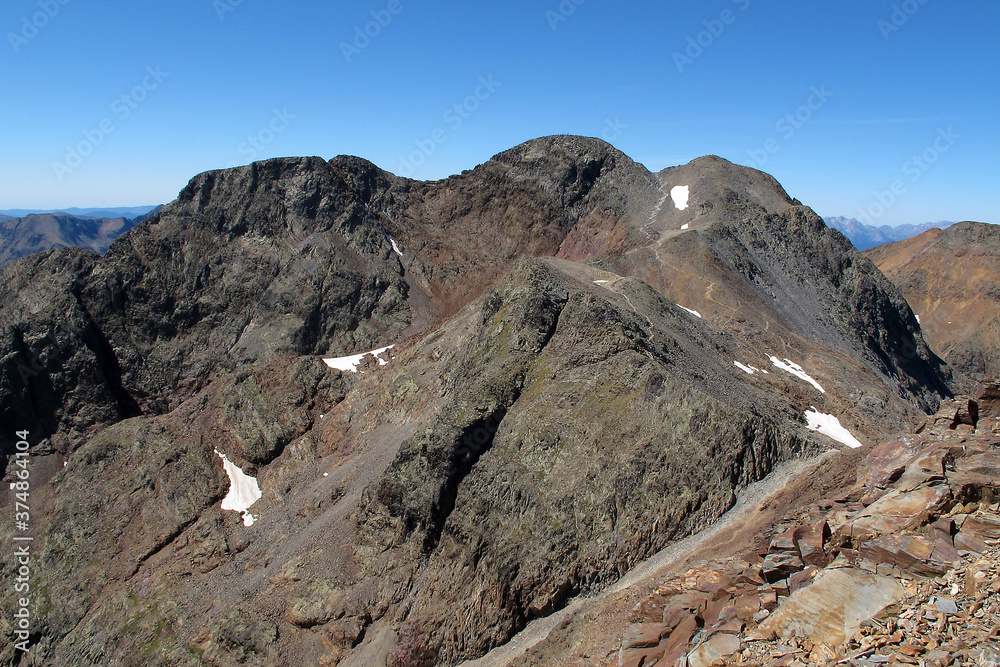 View of Pica Estats, a 3143 metres high mountain in the Montcalm Massif, Pyrenees, on the Spanish - French border. Is the highest mountain in Catalonia. View of Pica Estats, a 3143 metres high mountain in the Montcalm Massif, Pyrenees, on the Spanish - French border. Is the highest mountain in Catalonia.