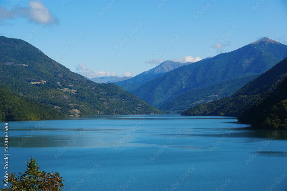Mountain Lake. blue water of a quiet lake surrounded by mountains