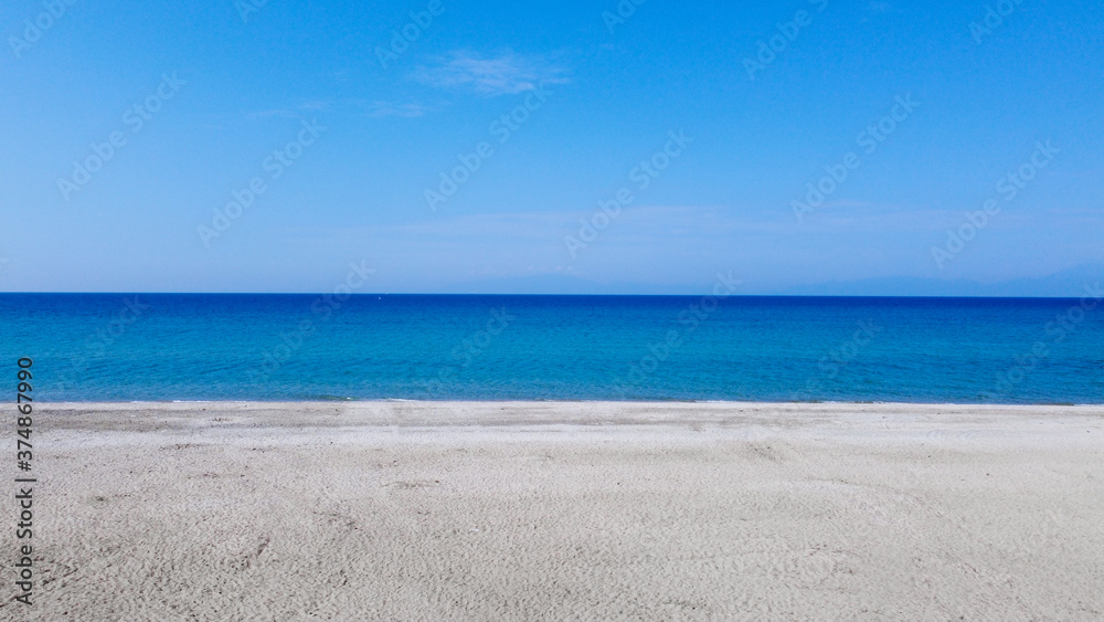 Aerial view of empty tropic sand beach and blue sea Aerial view of empty tropic sand beach and blue sea