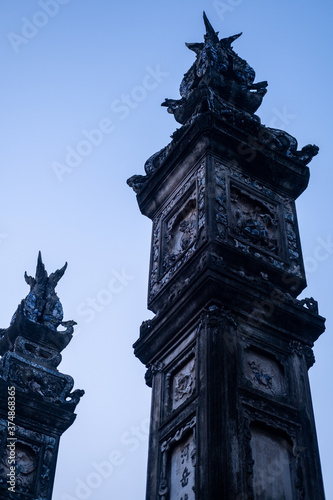 Pillar in front of a pagoda temple by the river in hanoi