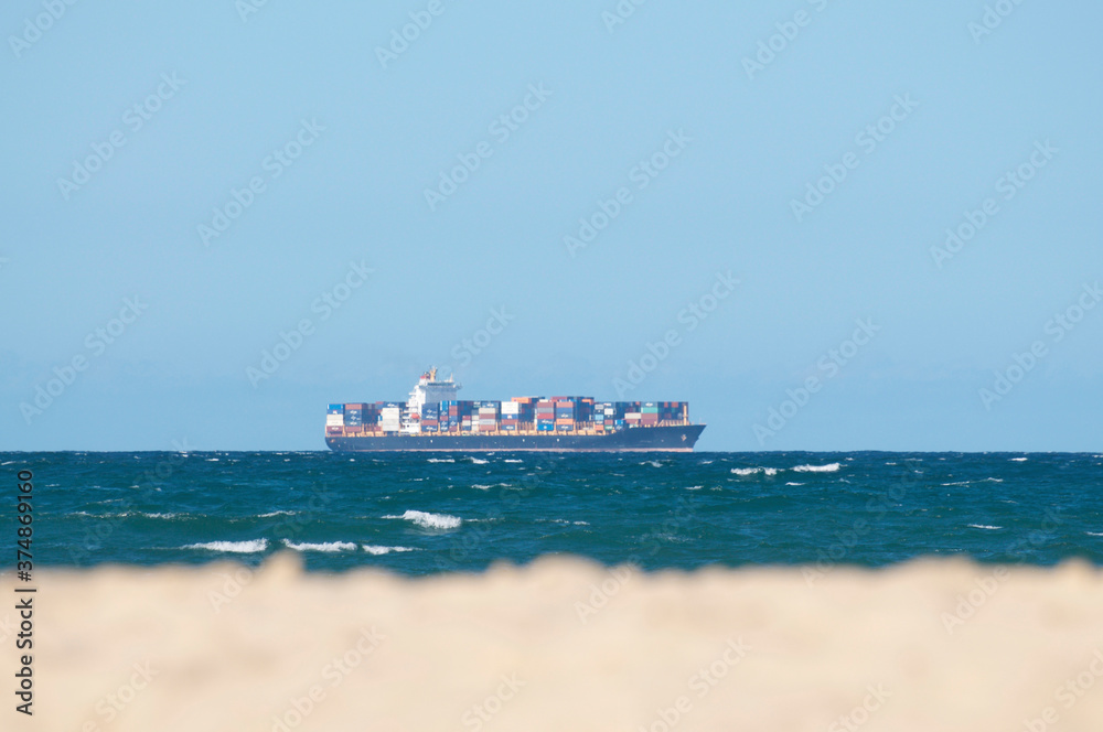 Cargo ship with container freight on the australian Sea
