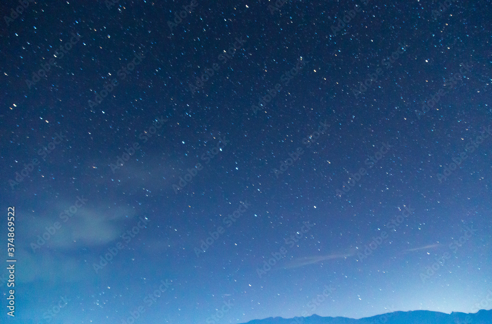 Starry sky and clouds. Over the high mountains. Starry sky and clouds. Over the high mountains.