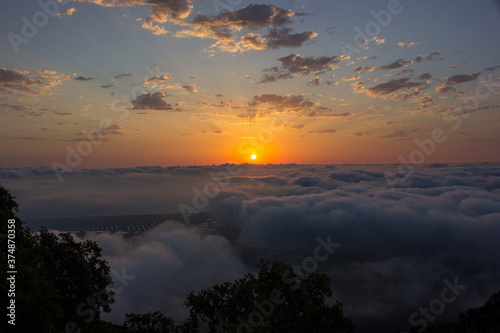  sunrise above the clouds on a mountain
