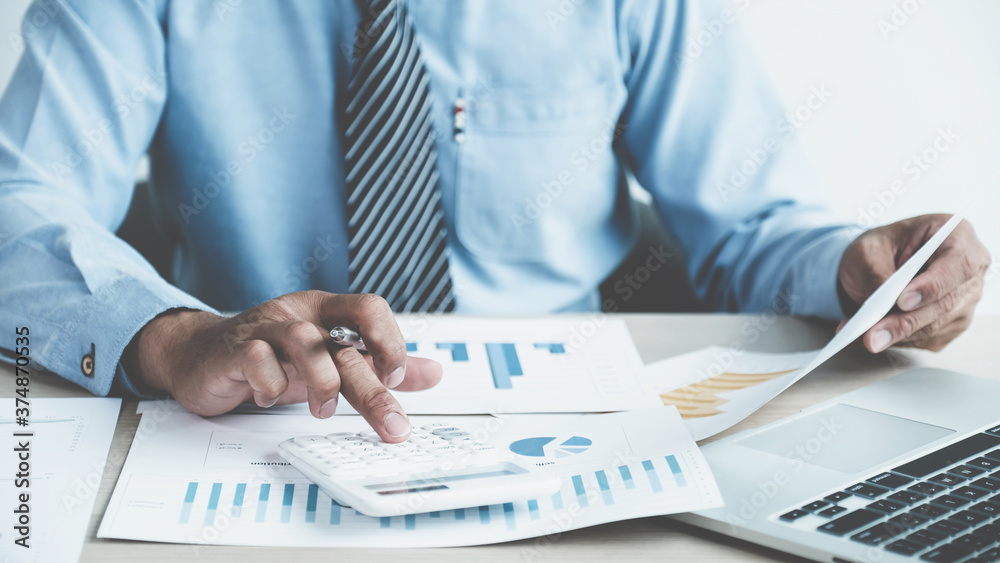 Businessman analysis the chart with laptop at the office for setting challenging business goals And planning to achieve the new target. Businessman analysis the chart with laptop at the office for setting challenging business goals And planning to achieve the new target.