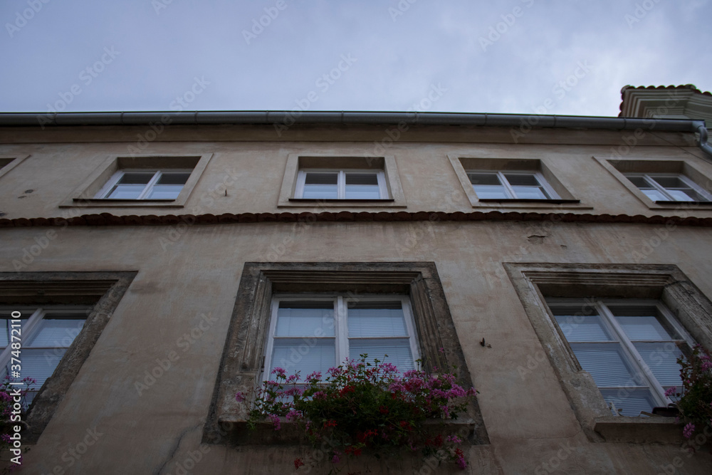 Old house with flowers from below in Czech Republic