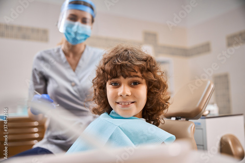 Young patient looking happy at dentist office