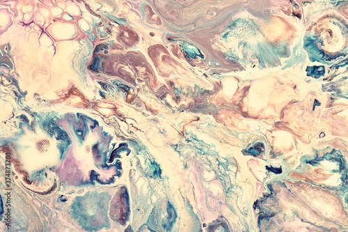 Magic Fluid Art. Abstract colorful background, wallpaper. Mixing paints. Modern art. Marble texture. Colorful canvas.