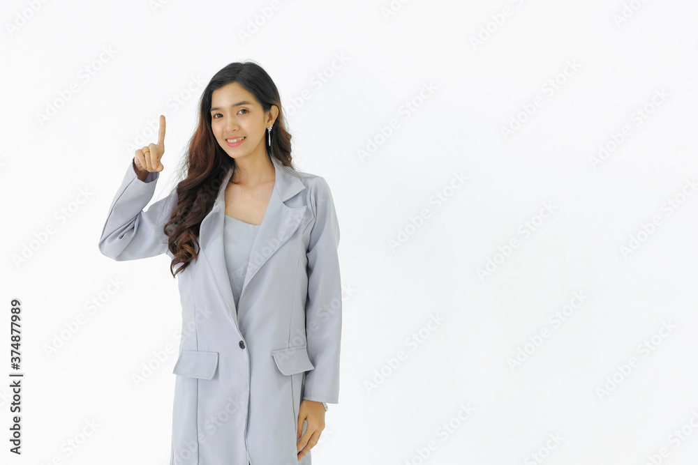 Young asian business woman stand showing one finger up with smiling face on white isolated background. Young asian business woman stand showing one finger up with smiling face on white isolated background.