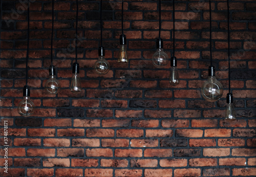 light bulbs in loft style on brick wall background