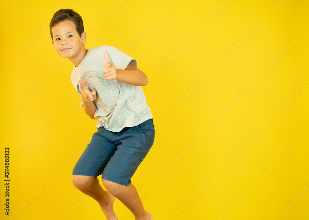 Handsome boy jumps up in the air Handsome boy jumps up in the air