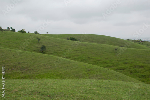 LANDSCAPE GREEN HILL SLOPE WITH CLOUD 