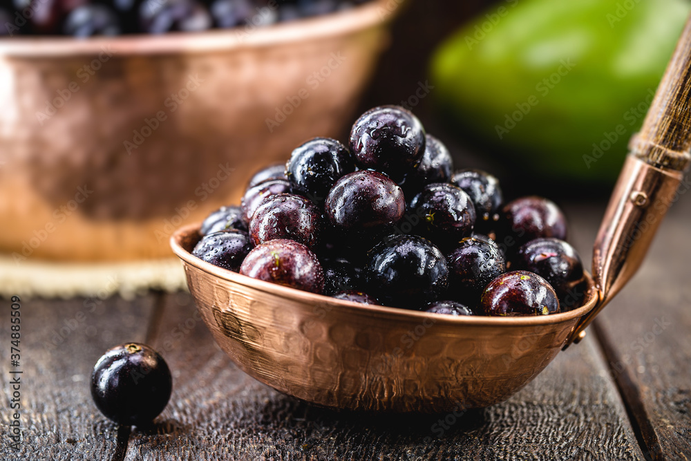 portion of jabuticabas in copper shell, typical fruit of Brazil, also called jaboticaba portion of jabuticabas in copper shell, typical fruit of Brazil, also called jaboticaba
