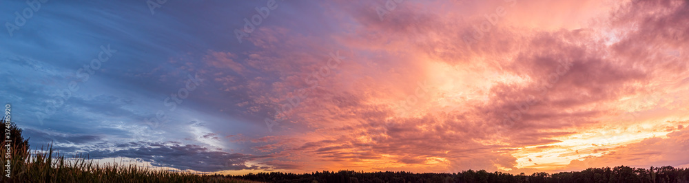 Colorful and dramatic sky panorama of sunset background