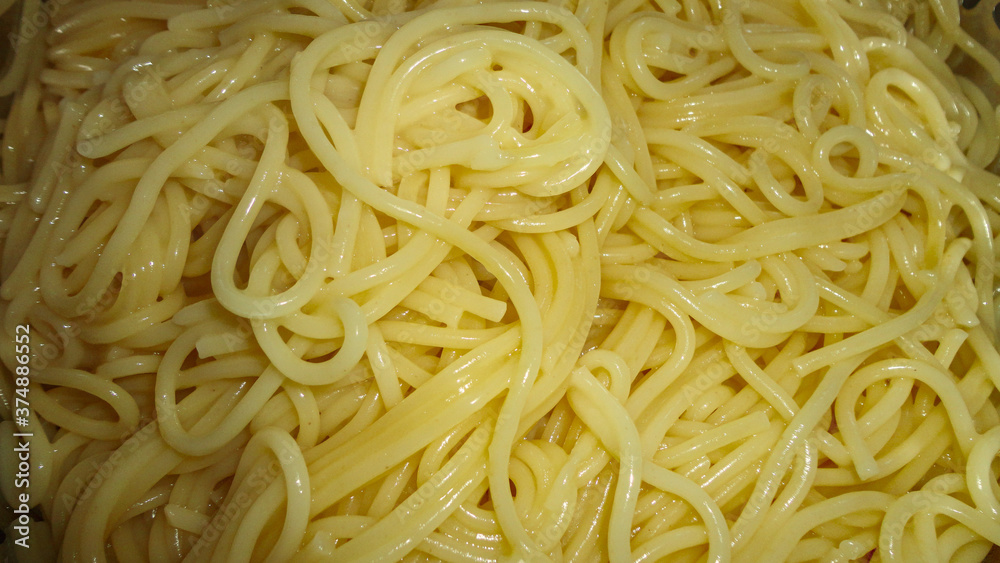 A large bowl with freshly cooked sphaghetti closeup A large bowl with freshly cooked sphaghetti closeup