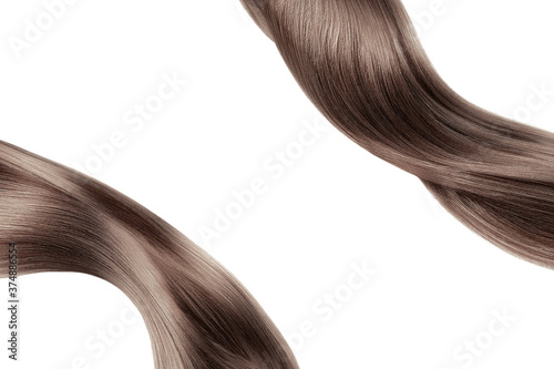 Brown shiny hair isolated on white. Background with copy space