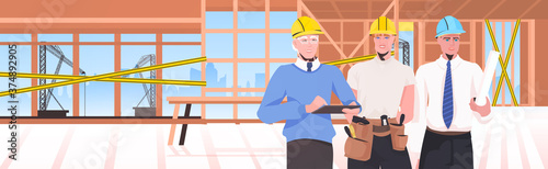 builders team at construction site engineers in helmets discussing during meeting repair service concept unfinished building interior horizontal vector illustration