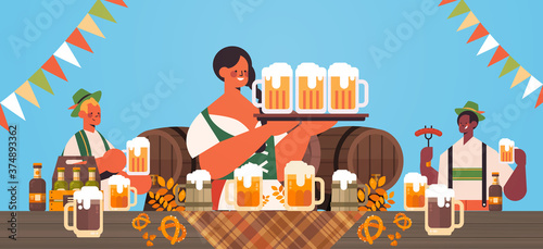mix race waiters holding beer mugs Oktoberfest party celebration concept people in german traditional clothes having fun portrait horizontal vector illustration