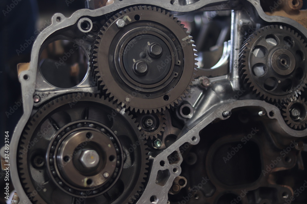 The mechanic is checking the engine. The mechanic is checking the engine.