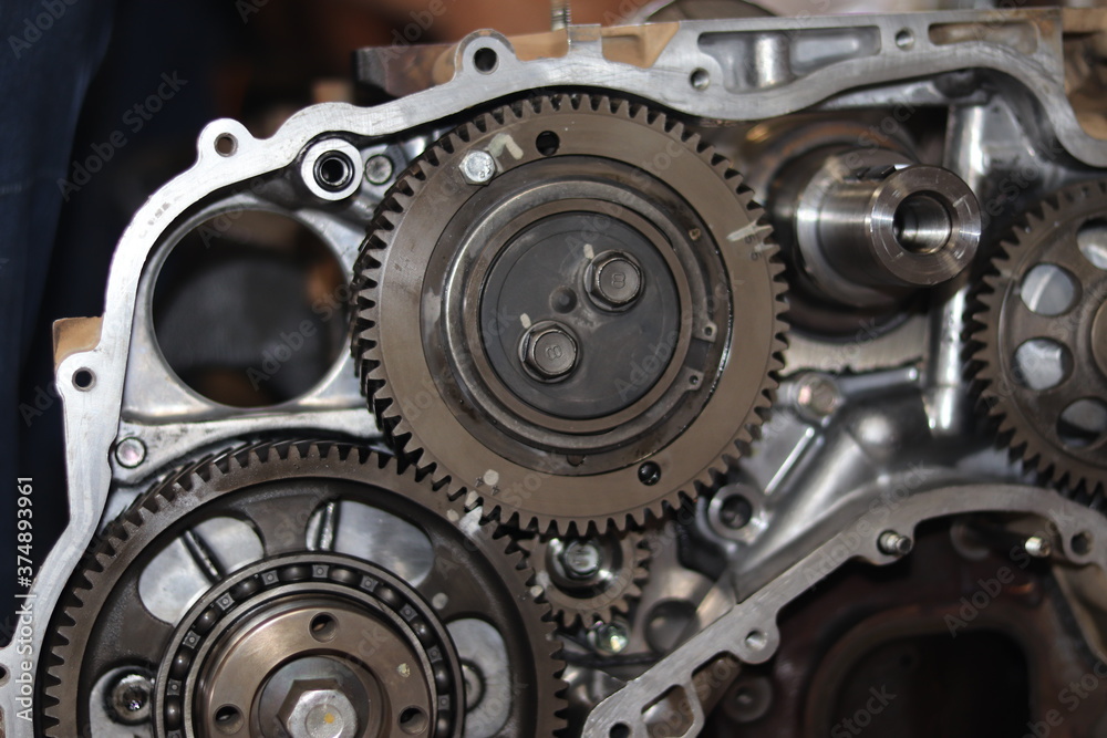 The mechanic is checking the engine. The mechanic is checking the engine.