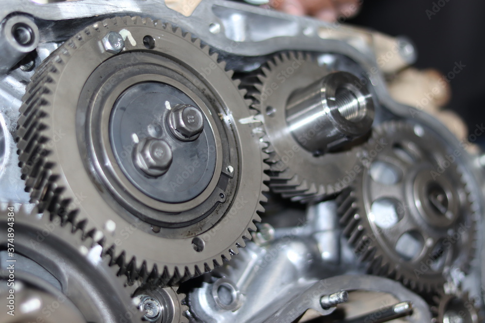 The mechanic is checking the engine. The mechanic is checking the engine.