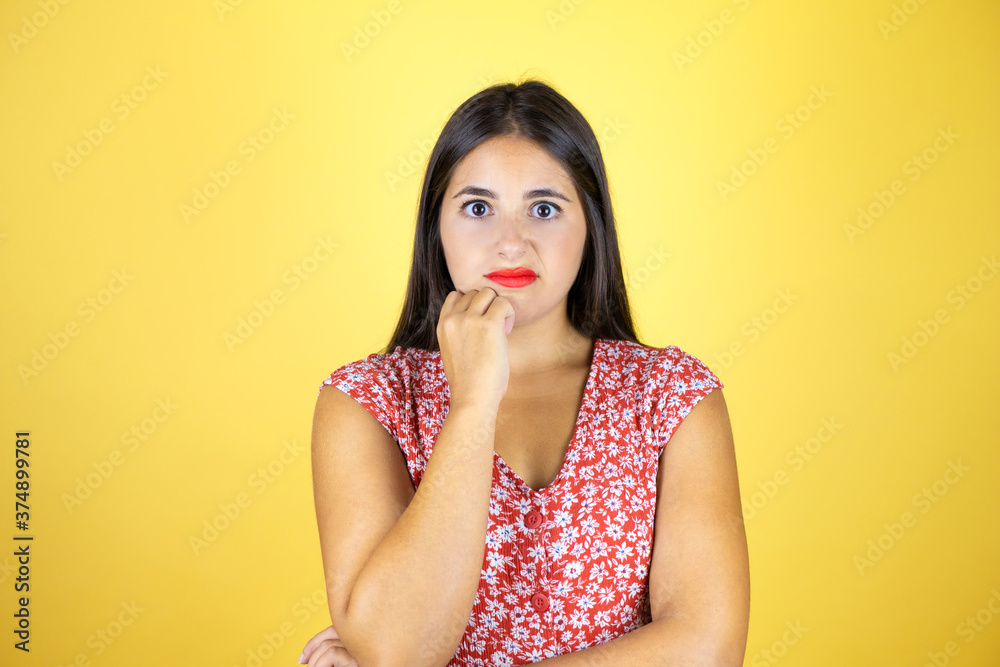Young beautiful woman over isolated yellow background thinking looking tired and bored with crossed arms Young beautiful woman over isolated yellow background thinking looking tired and bored with crossed arms