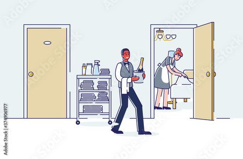 Room service workers of hotel. Maid cleaning room and clerk bring wine bottle to visitor
