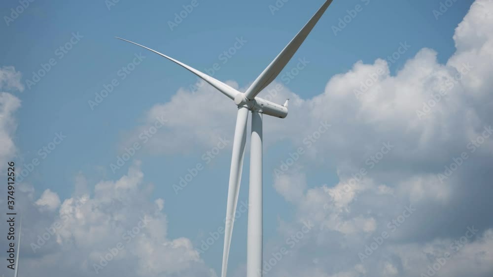 Time lapse of windmills farm for energy production on beautiful sky.Wind power turbines generating clean renewable energy for Sustainable development goals. Time lapse of windmills farm for energy production on beautiful sky.Wind power turbines generating clean renewable energy for Sustainable development goals.
