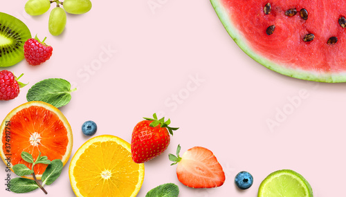 Fototapeta Naklejka Na Ścianę i Meble -  Healthy Fruit background. Colorful fresh fruits and berries on pink background.