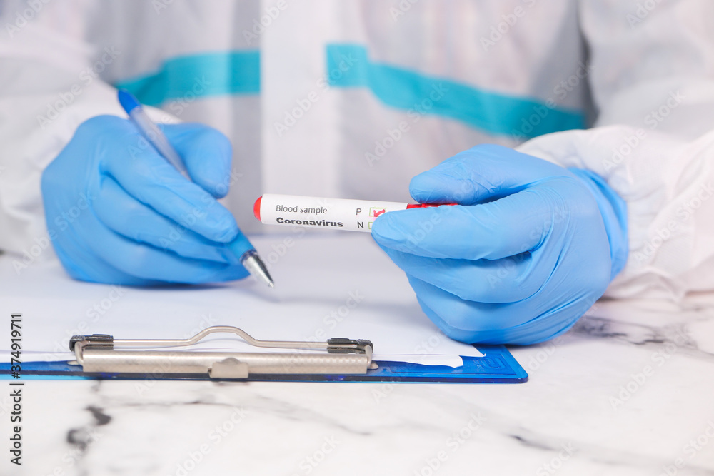 laboratory technician hand holding blood test tube laboratory technician hand holding blood test tube