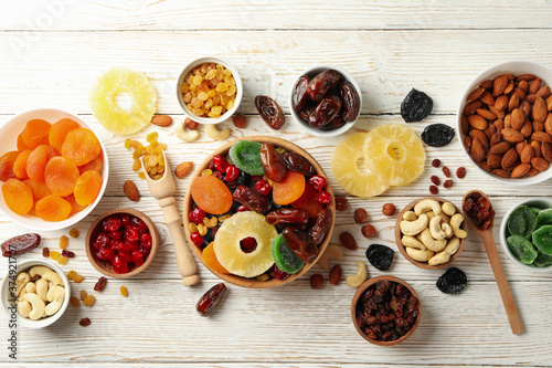 Wallpaper Mural Bowls with dried fruits and nuts on white wooden background Torontodigital.ca