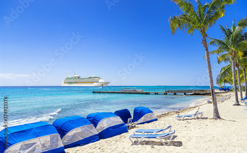Fototapeta Naklejka Na Ścianę i Meble -  View from tropical beach on cruise ship sailing to port 