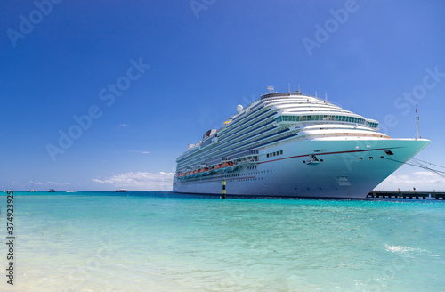 Luxury cruise ship in port on sunny day