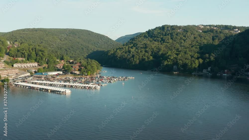 Flying towards marina on Cheat Lake near Morgantown in West Virginia from aerial drone shot above the water Flying towards marina on Cheat Lake near Morgantown in West Virginia from aerial drone shot above the water