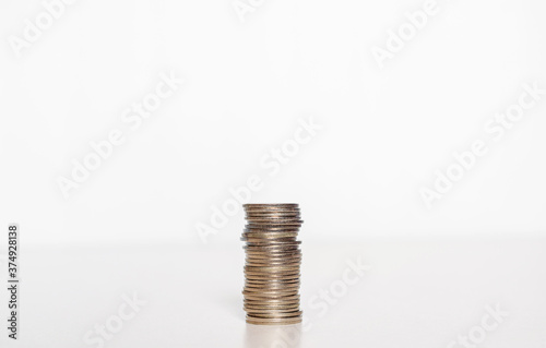 silver coin stack row growing pile on white background for money saving and investment business financial and banking concept.