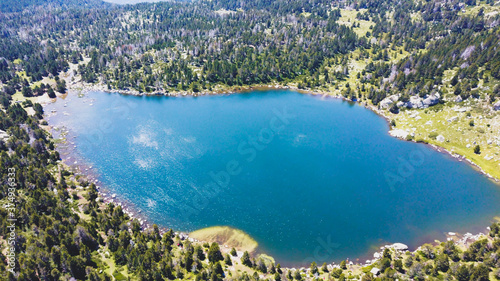 Beautiful Blue Lake of Malniu, Catalan Pyrenees Mountains, Spain. © Bernat