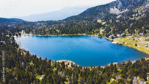 Beautiful Blue Lake of Malniu, Catalan Pyrenees Mountains, Spain.