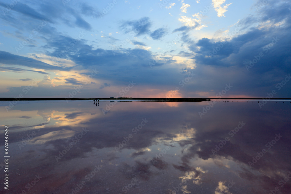 sunset sky over dead salt lake water surface