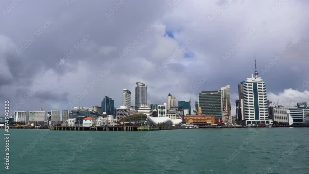 Panoramic Views Of Auckland Cityscape, Harbourside Buildings And City Marina With Blue Ocean Water On Cloudy Day In New Zealand