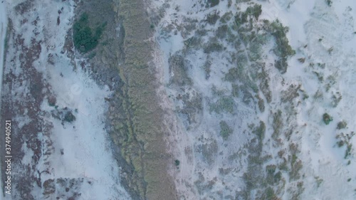 Wallpaper Mural Aerial dolly forward shot of coastal dunes at sunset. Birds eye Torontodigital.ca
