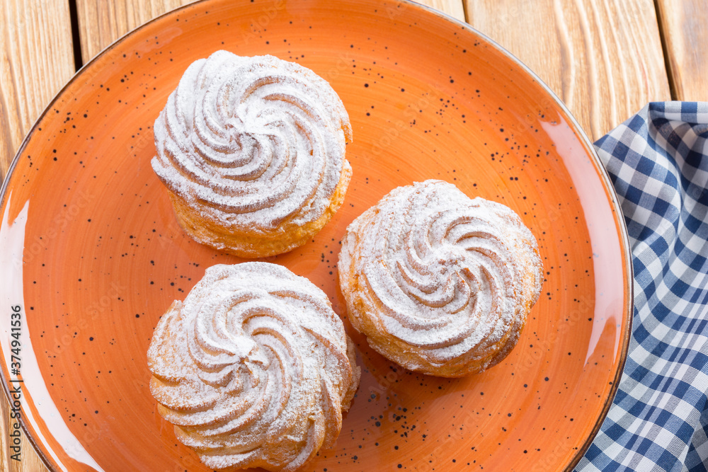 Small french cookies profitroles with sugar powder Small french cookies profitroles with sugar powder