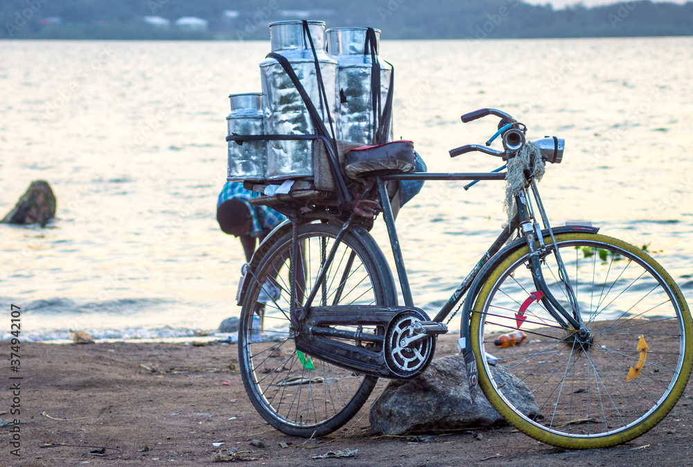 Fototapeta premium Special bicycle for carrying milk on the beach