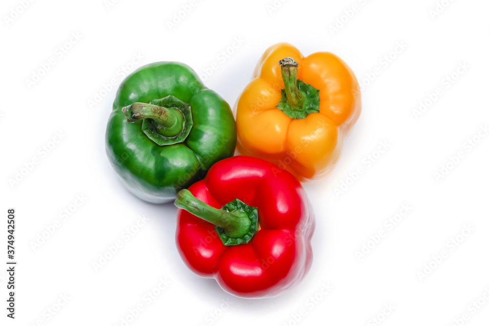 Top view of Bell peppers on white background. Red, Yellow and Green fresh bell pepper