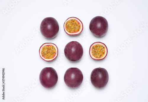 Fresh ripe passion fruits (maracuyas) on white background, flat lay