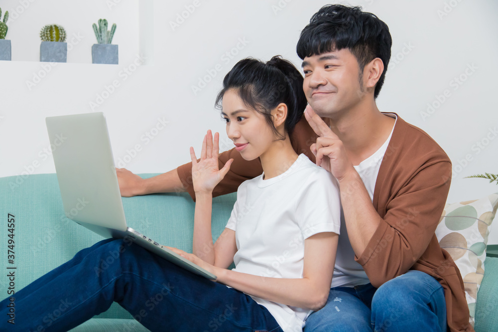 Happy young couple talking through the computer with video chat. Happy young couple talking through the computer with video chat.