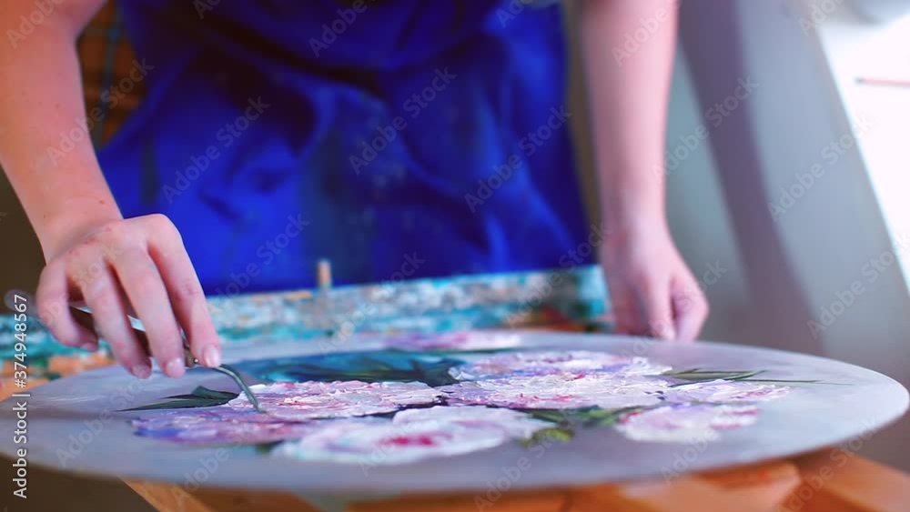 View from above. Making a picture in an art workshop. Lesson in easel art in your free time. Realization of human creative abilities. View from above. Making a picture in an art workshop. Lesson in easel art in your free time. Realization of human creative abilities.