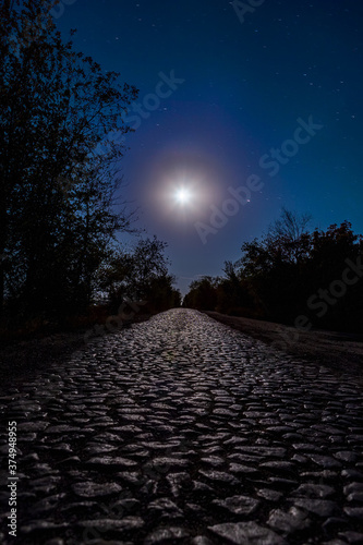 Photo of road in the moonlight