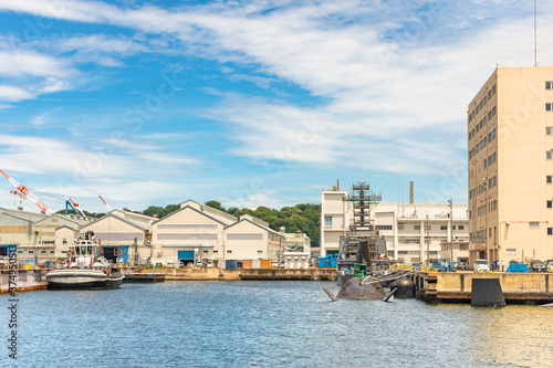 yokosuka, japan - july 19 2020: United States Navy valiant tug Puyallup YT-806, Japanese Sōryū-class submarine 16SS and Auxiliary Multi-purpose Support ship JS Enshu AMS-4305 in Yokosuka naval port. photo