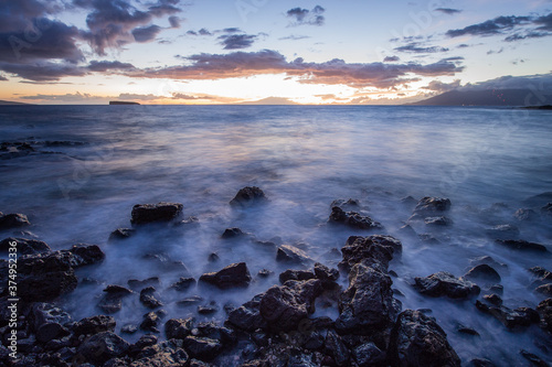 Long exposure shot of the Molokini crater viewed from Little Beach in Maui, Hawaii.