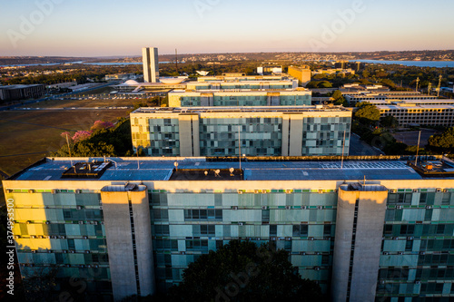BRASILIA   BRAZIL - JULY 6 2019  Aerial shot of the National Congress Building in Bras  lia along with some Ministries right before sunset.